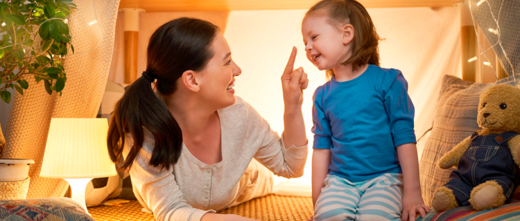 Mother with Special Needs Child Playing in Child's Room