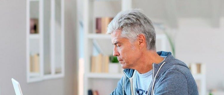 Man working on his estate plan on a laptop
