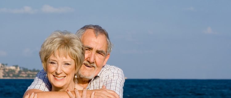 Happy Senior Couple On Vacation at the Beach